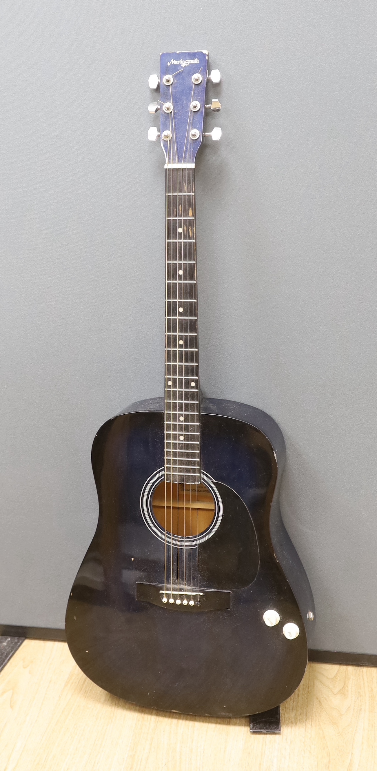 A Martin Smith electro-acoustic guitar in a Ritter soft case